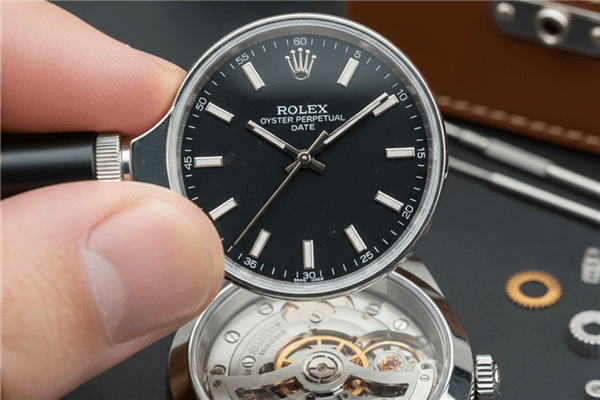 A magnifying loupe examining the dial of a luxury watch