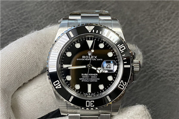 A close-up macro shot of a Rolex dial and hands showing perfect finishing