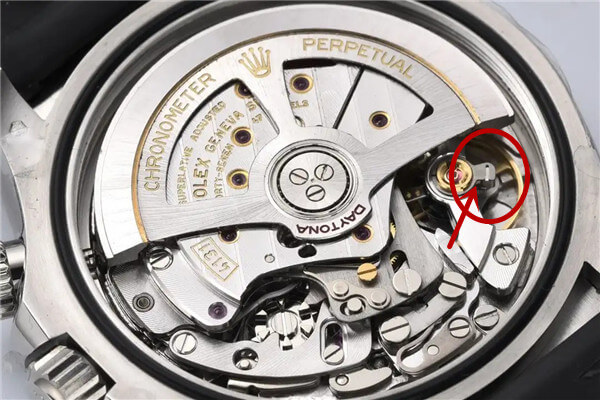 A macro shot comparing a genuine Rolex balance wheel with a clone version