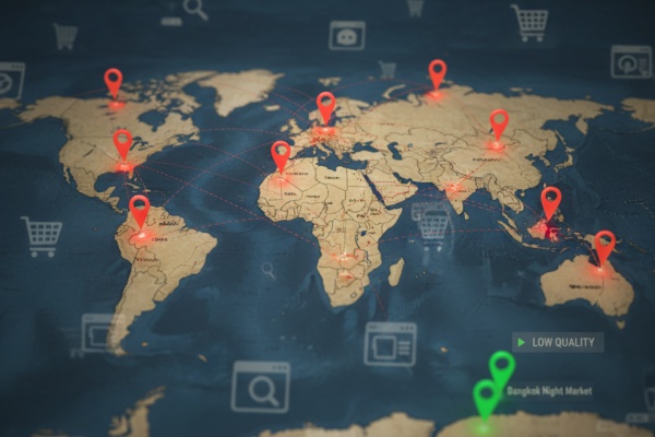 A world map with pins on major cities