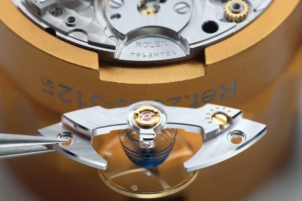 A watchmaker servicing a high-end replica movement