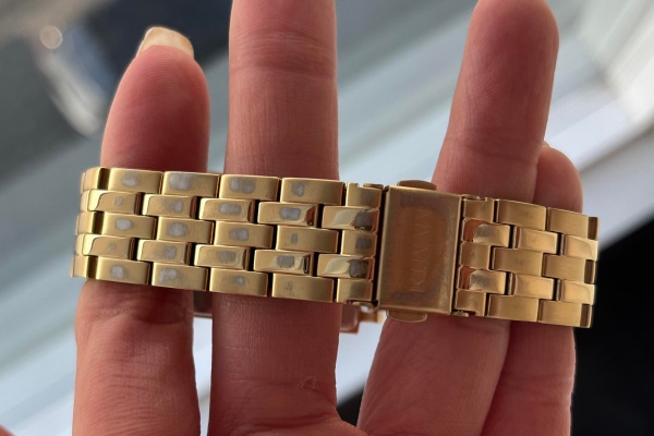A gold-plated replica watch showing some wear