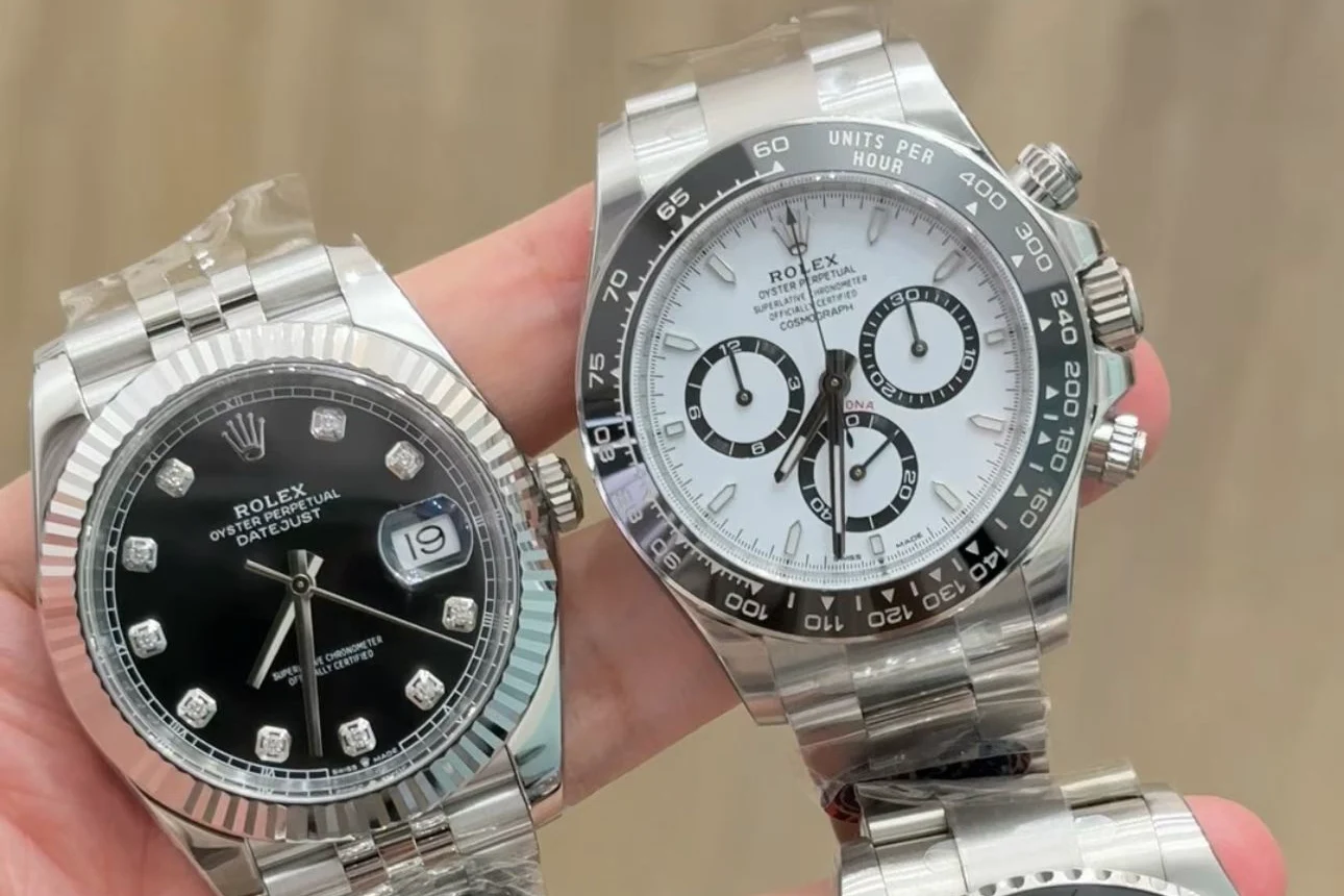 A watch dealer inspecting a Victory Factory GMT replica with a loupe