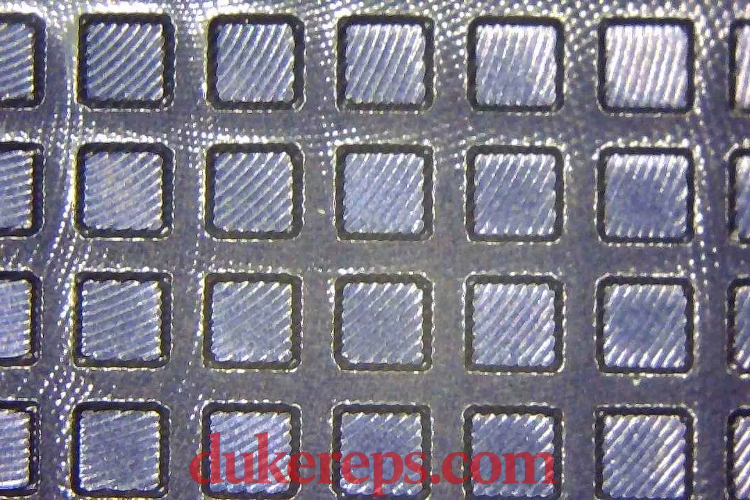 A macro shot of the VSF AP 15500 blue dial showing the tapisserie pattern