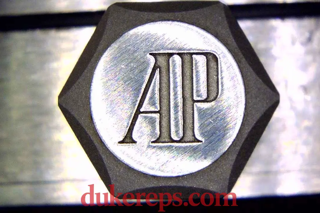 A macro shot of the VSF AP 15500 blue dial showing the logo on the crown