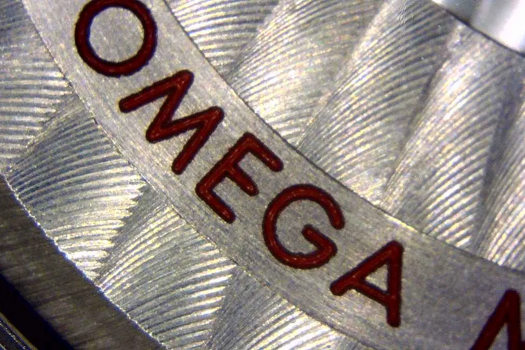 A macro shot of the Geneva stripes on a replica movement bridge